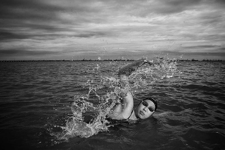National open-water swimmer Chantal Liew training in the sea and posing out of it. ST PHOTOS: KEVIN LIM