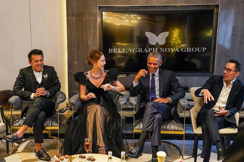 Above: This image of former United States president Barack Obama with (from left) Mr Nelson Loh, Ms Evangeline Shen and Mr Terence Loh was released by the Bellagraph Nova Group when it announced its Newcastle bid on Aug 15. It later emerged that the 