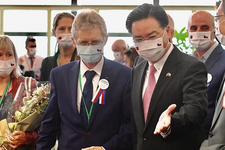Czech Senate Speaker Milos Vystrcil being greeted by Taiwan Foreign Minister Joseph Wu upon his arrival at the island's airport in Taoyuan yesterday. Mr Vystrcil, who is leading a 90-member group on the Taiwan trip, will deliver a speech in Taiwan's 