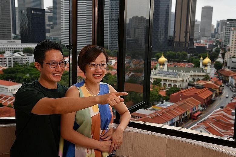 Above: Ms Andrea Ang and her husband Gary Lim in the balcony of their five-room HDB flat in Crawford Lane, which overlooks the historic and colourful neighbourhood of Kampong Glam. Below: Mr Sathiyasivan Balakrishnan and his wife Durgashini Sathiyasi