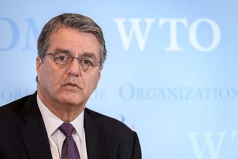 Mr Roberto Azevedo's announcement in May that he would end his second WTO term 12 months early forced the organisation to speed up its process of selecting a new leader. PHOTO: AGENCE FRANCE-PRESSE