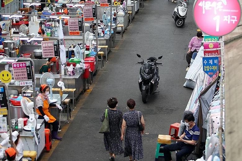 Daegu's Seomun Market saw few visitors amid tightened social distancing rules yesterday. Once hailed as a role model for successfully curbing the Covid-19 outbreak, South Korea is now struggling to cope with fresh cases. PHOTO: EPA-EFE
