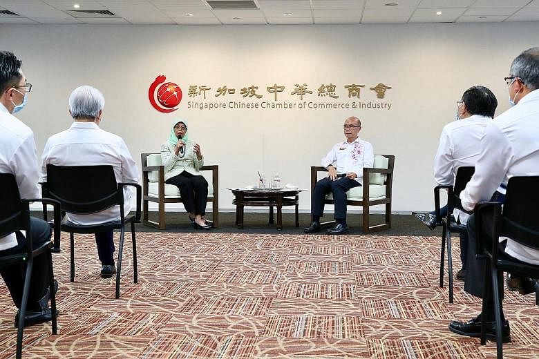 President Halimah Yacob speaking at a dialogue with members of the Singapore Chinese Chamber of Commerce and Industry yesterday. She later said that based on discussions and feedback during the session, companies are exploring new opportunities, such