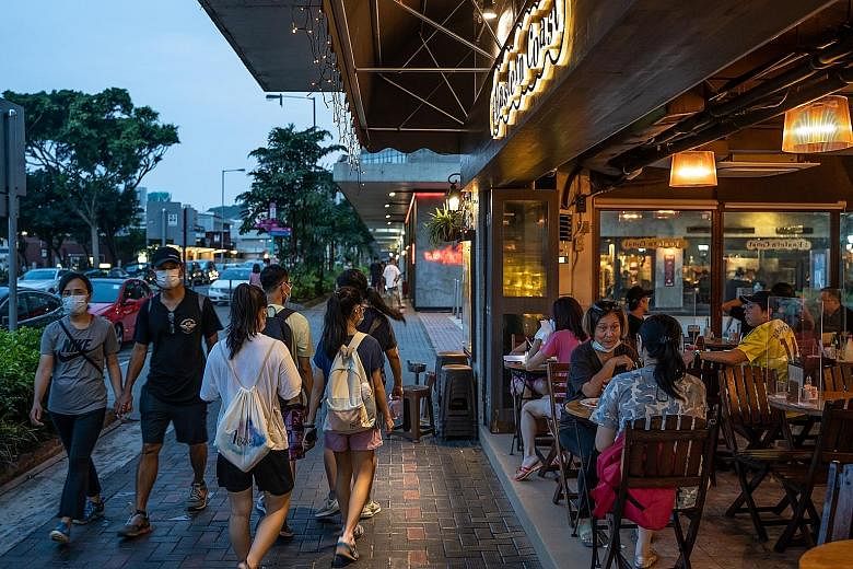Restaurants in Hong Kong can offer dine-in services until 10pm instead of 9pm from tomorrow. A cap of two people at each table will remain in effect. The city has been gradually easing social distancing measures as it brings its biggest Covid-19 outb