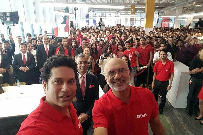 A 2017 wefie of DBS Bank chief executive Piyush Gupta (right, foreground) with employees in India, where the bank had opened a new office. Prime Minister Lee Hsien Loong noted how the photo was posted online to suggest that the bank was favouring for