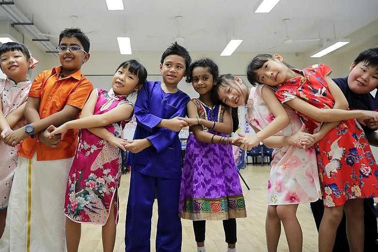 Primary school pupils celebrating Racial Harmony Day last year. Minister for Culture, Community and Youth Edwin Tong said common spaces like schools, libraries and public housing, where all races interact, promote a more open and shared outlook acros