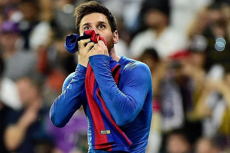 Lionel Messi kissing the Barcelona jersey in celebration back in 2017. The Argentinian confirmed yesterday that he will be staying with the Catalan giants, insisting that he could never take "the club of his life" to court. PHOTO: EPA-EFE