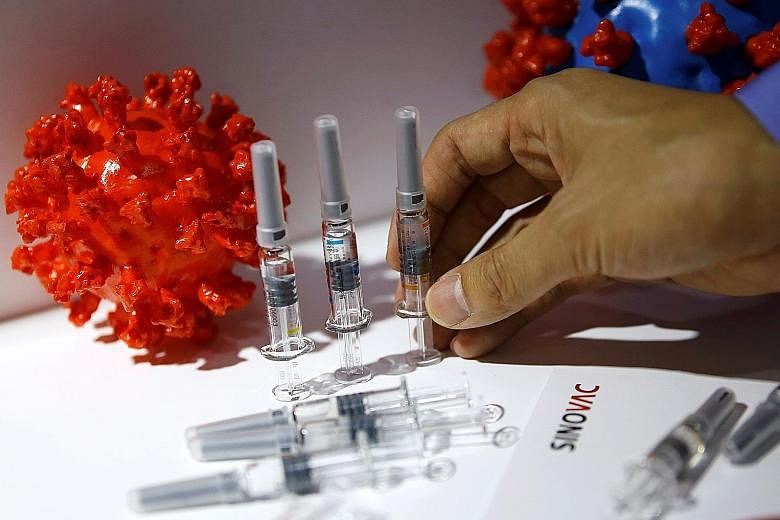 A coronavirus vaccine candidate from Sinovac Biotech at its booth during the 2020 China International Fair for Trade in Services in Beijing yesterday. Governments across the world are hoping to announce a vaccine as soon as possible. PHOTO: REUTERS