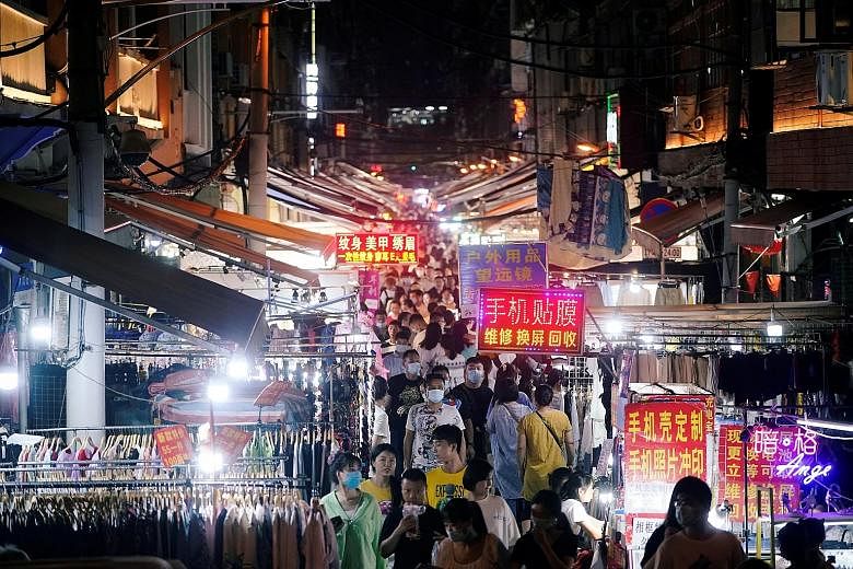 A street market in Wuhan teeming with people last week. No new local Covid-19 transmissions have been reported in the Chinese city for months and life has returned to normal.