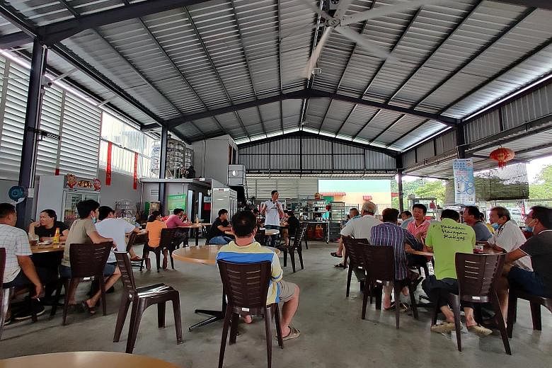Above: Save Musang King Alliance chairman Chang Yee Chin briefing durian farmers at a coffee shop in Sungai Klau last Thursday. Left: While most of the farmers are Chinese, there are also over 100 Malay families who work these lands. They include far