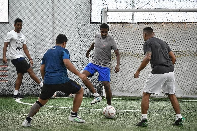 A group at a session of The Cage's recently launched football fitness programme, which allows amateur footballers to try drills done by professionals. ST PHOTO: ARIFFIN JAMAR