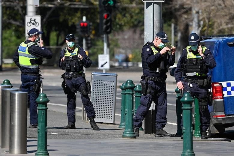 Police on street patrol in Melbourne yesterday. State Premier Daniel Andrews extended the hard lockdown, in place since Aug 2, as infection rates have declined more slowly than hoped.