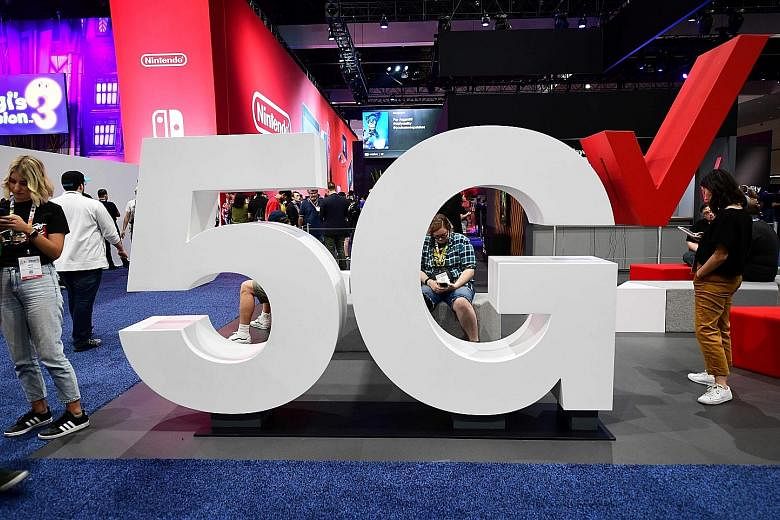 A Verizon 5G display at last year's Electronic Entertainment Expo in Los Angeles. The next-generation 5G wireless network is expected eventually to connect and enable high-speed video transmissions and self-driving cars, among other uses. PHOTO: AGEN