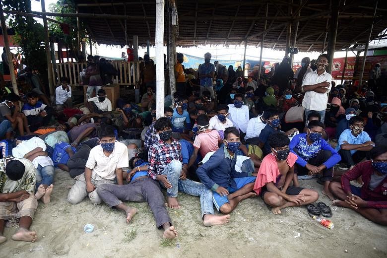 The Rohingya migrants who arrived by boat near Lhokseumawe city, Aceh, yesterday were spotted at sea by locals who helped them land.