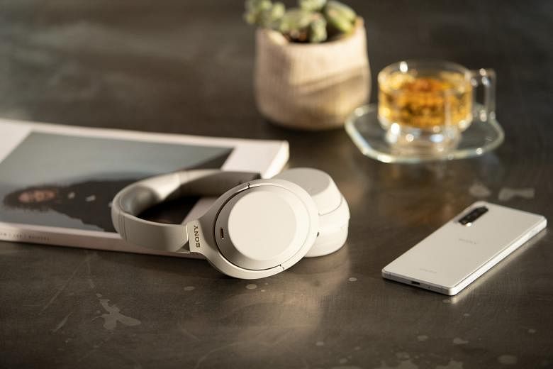 The Sony WH-1000XM4 can connect to two devices at the same time, and pauses music playback and lets in ambient sound when it detects you are talking.