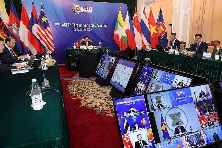 Vietnam's Deputy Prime Minister Pham Binh Minh chairing the video meeting with Asean foreign ministers in Hanoi yesterday. Joining them are US Secretary of State Mike Pompeo and his Chinese counterpart Wang Yi, with the "power rivalry" between their 