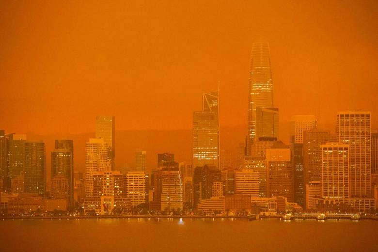 In Pictures: Skies turn orange as uncontrolled wildfires spread through ...