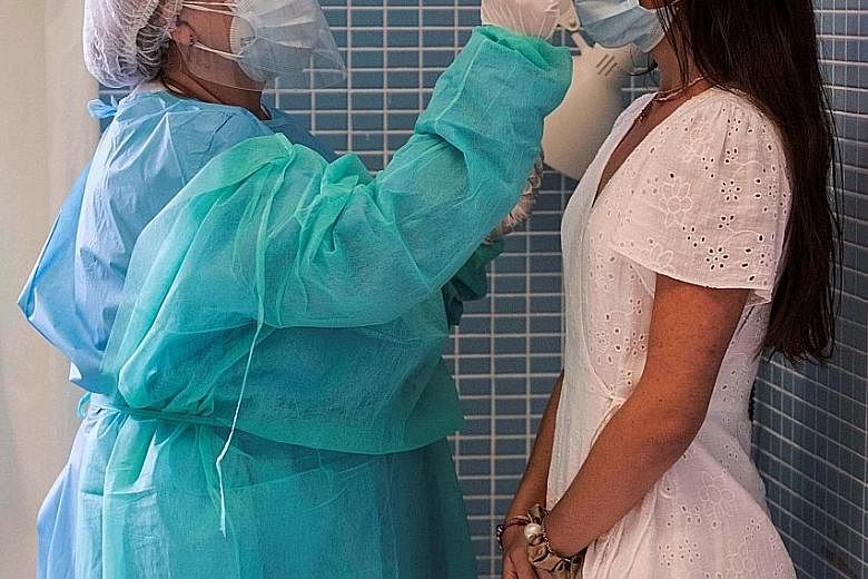Data from testing people for the Covid-19 virus can yield life-saving insights but there is also concern over how officials, swayed by emotions, politics and, above all, preconceptions, interpret the numbers. PHOTO:EPA-EFE