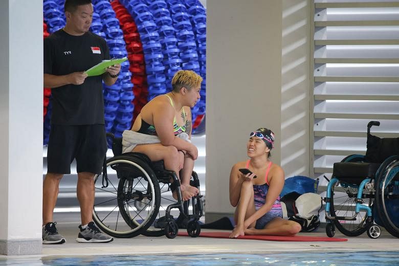 Theresa Goh and Yip Pin Xiu at last year's SPH Foundation National Inclusive Swimming Championships. Goh wants to serve on the SDSC's exco now that she has more energy and time while Yip wants to get more athletes with disabilities to play sport. ST 