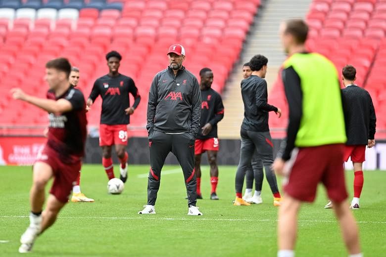 Liverpool manager Jurgen Klopp (looking on during their warm-up before the Community Shield match against Arsenal) is wary of Leeds' well-drilled side.