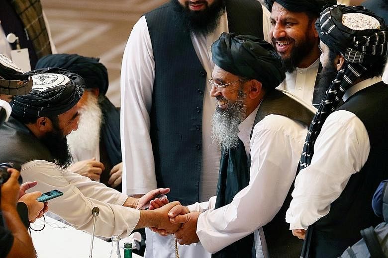 Taleban delegates at a ceremony yesterday in Doha, Qatar, to launch talks with an Afghan government team, aimed at ending two decades of war.