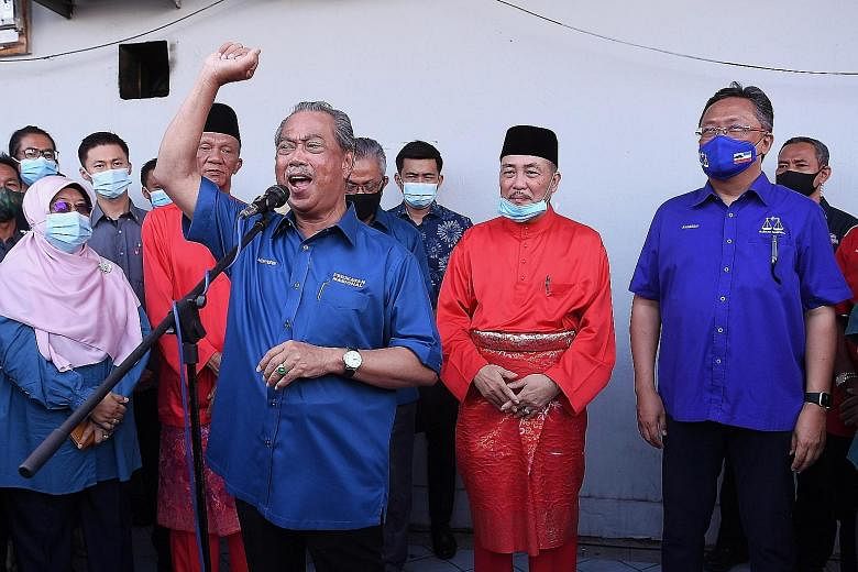 Malaysian Prime Minister Muhyiddin Yassin delivering a speech at a gathering before the nomination process for the state election at the Parti Pribumi Bersatu Malaysia office in Tuaran, Sabah yesterday. The Premier flew into the state early on Friday