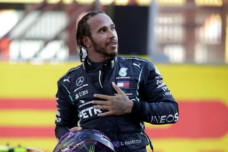  Mercedes' Lewis Hamilton celebrates after winning the Tuscan Grand Prix in Mugello, Italy, on Sept 13.