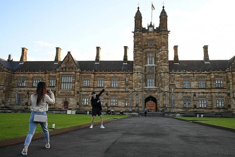 International students from China taking photos on campus at the University of Sydney in Australia. Some 19,000 Singapore students are enrolled in universities in the United States, Britain and Australia. Last month, Education Minister Lawrence Wong 