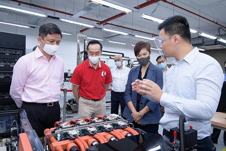 (From left) Minister for Trade and Industry Chan Chun Sing; National Trades Union Congress deputy secretary-general and Senior Minister of State for Health Koh Poh Koon; and Minister for Manpower Josephine Teo being given a tour of semiconductor test