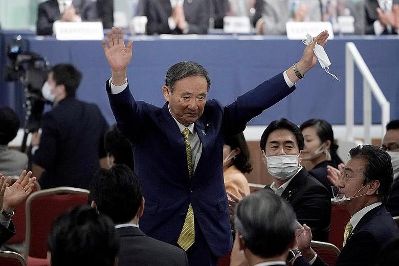 Japanese Chief Cabinet Secretary Yoshihide Suga acknowledging his victory after he was elected the new head of the ruling Liberal Democratic Party at the party's leadership election in Tokyo yesterday. He was the runaway champion, winning around 70 p