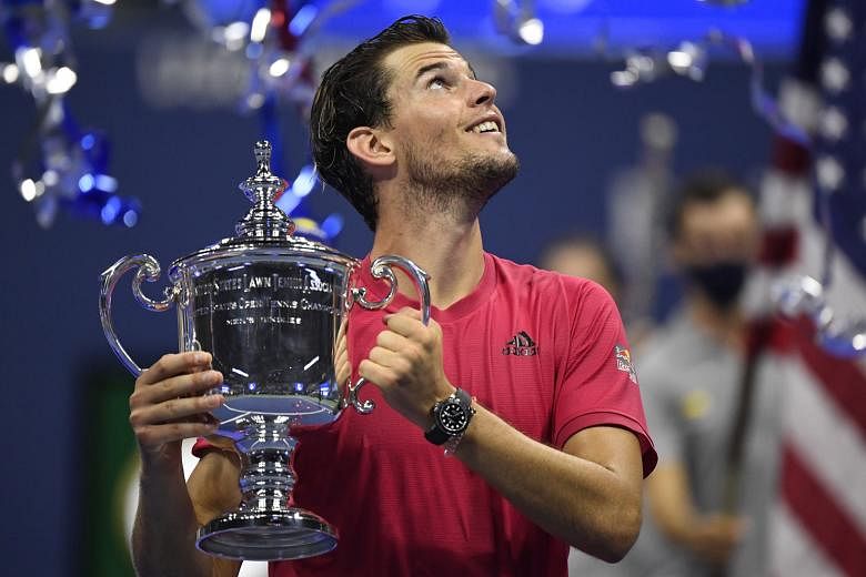 Dominic Thiem of Austria celebrates with the US Open winner's trophy after beating Germany's Alexander Zverev in the men's singles final. He is the first player outside of Rafael Nadal, Novak Djokovic and Roger Federer to win a Grand Slam in four yea
