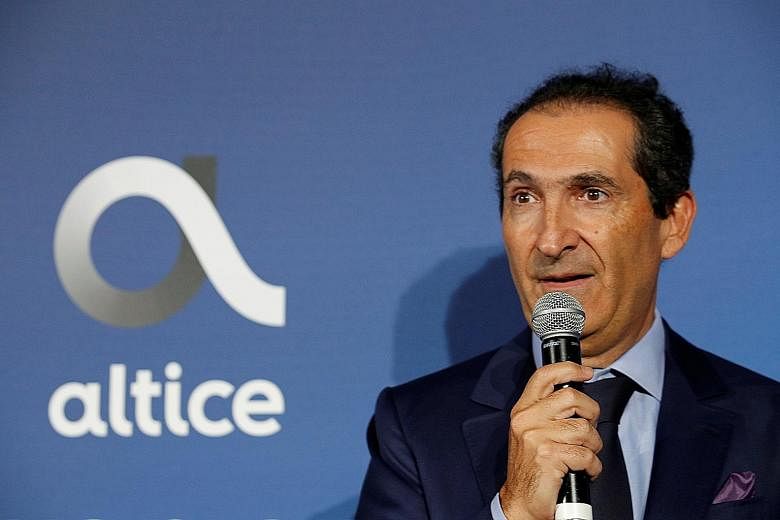 Top: SoftBank chairman Masayoshi Son is revisiting the idea of a management buyout of the Japanese conglomerate. Above: Media magnate Patrick Drahi is offering €2.5 billion (S$4 billion) to take Altice Europe private. PHOTOS: REUTERS