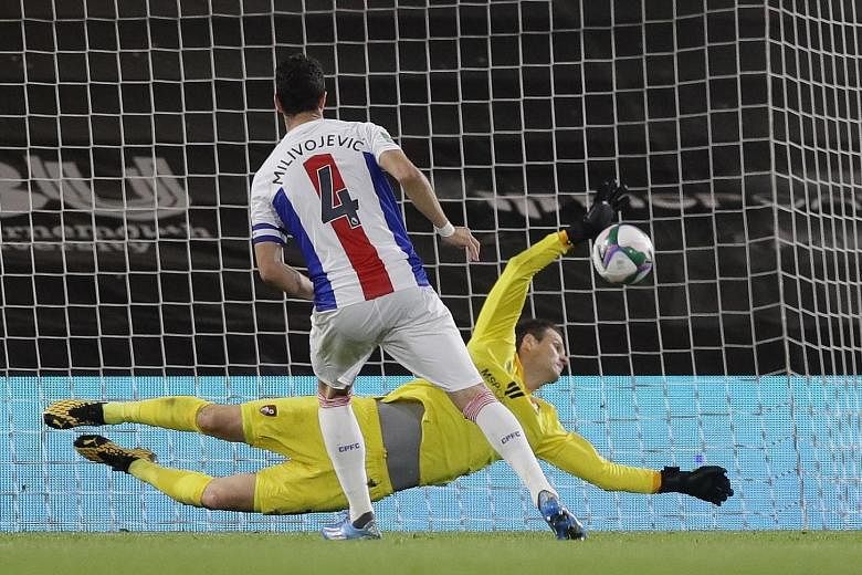 Goalkeeper Asmir Begovic saving Crystal Palace captain Luka Milivojevic's second spot kick in Bournemouth's 11-10 shoot-out win after the game ended 0-0 at full time on Tuesday. Bournemouth will advance to a third-round League Cup clash with holders 