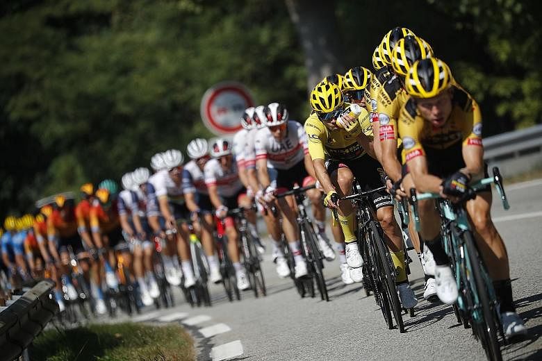 The peloton making its way up the slope during stage 17 of the Tour de France yesterday. Miguel Angel Lopez won the stage but overall leader Primoz Roglic managed to extend his advantage over fellow Slovenian Tadej Pogacar to 54sec. PHOTO: REUTERS