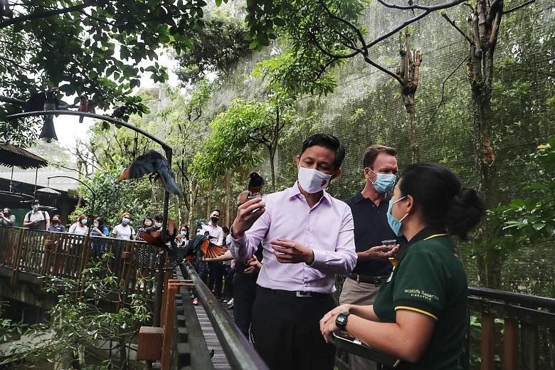 Trade and Industry Minister Chan Chun Sing, who unveiled details about the SingapoRediscovers Vouchers, on a visit to Jurong Bird Park yesterday with Mandai Park Holdings group chief executive Mike Barclay. Despite the pandemic-related setbacks, the 