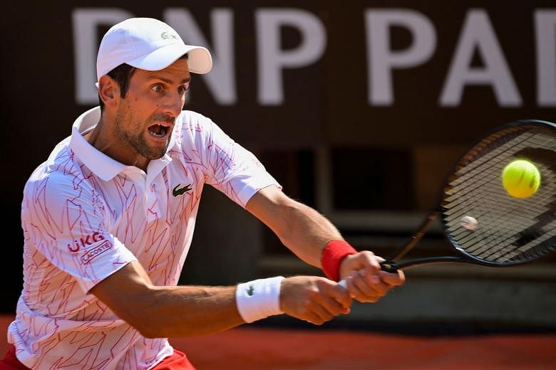 World No. 1 Novak Djokovic was on his best behaviour in the 6-3, 6-2 second round win over local hope Salvatore Caruso at the Italian Open yesterday. PHOTO: AGENCE FRANCE-PRESSE