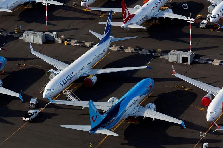 Boeing 737 Max aircraft at a parking lot at Boeing Field in Seattle, Washington, in June. The model has been grounded since March last year. PHOTO: REUTERS