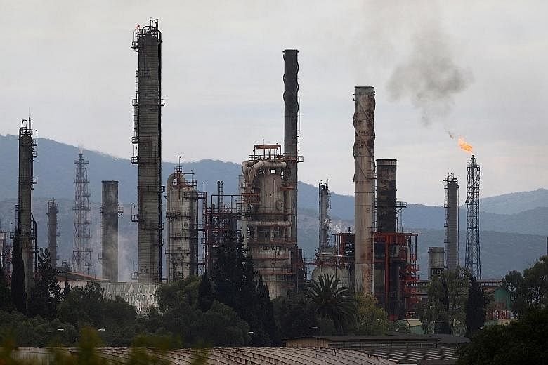 Excess natural gas being burned, or flared, from state-owned Pemex's Tula oil refinery in Tula de Allende, Mexico, on June 22. Rather than making greater effort to mitigate the demand for energy through conservation and energy-efficiency drives, or p