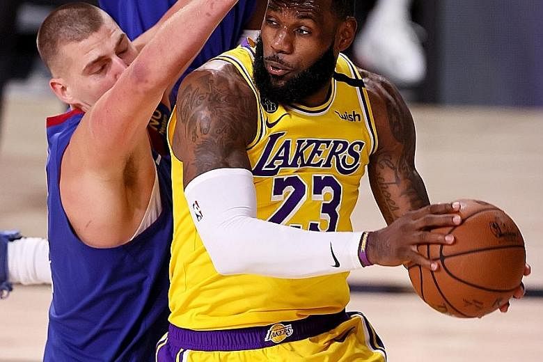 LA Lakers' LeBron James finds his way blocked by Denver Nuggets' Nikola Jokic during Game 1 of their NBA Western Conference Finals. James was upset after losing to the Milwaukee Bucks' Giannis Antetokounmpo in the NBA's MVP voting.