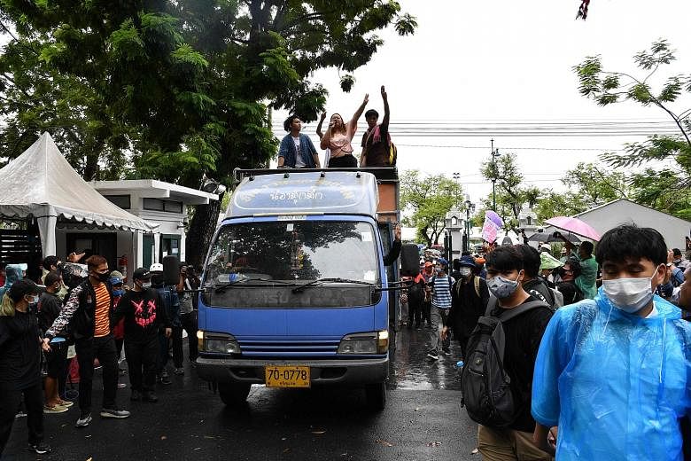 Protesters holding their mobile phones aloft, as they took part in a pro-democracy rally in Bangkok yesterday. They are demanding reforms to the powerful monarchy, removal of the government and fresh polls. PHOTOS: AGENCE FRANCE-PRESSE