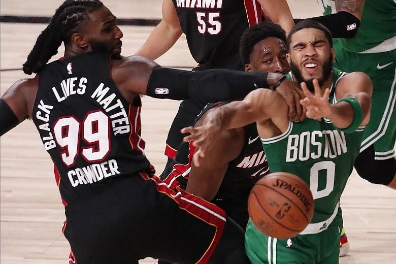 All-Star Jayson Tatum had 25 points, one fewer than the team-high tally recorded by fellow Boston forward Jaylen Brown as the Celtics beat the Miami Heat 117-106 to reduce the deficit in the Eastern Conference Finals to 2-1. PHOTO: EPA-EFE