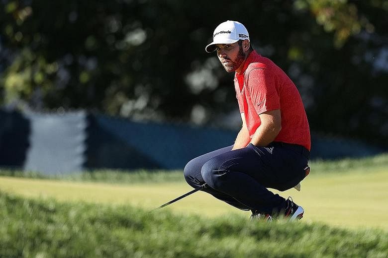 Matthew Wolff reacting to a missed birdie putt on the 15th hole in the third round on Saturday at Winged Foot Golf Club. He was aiming to be the youngest US Open champion in the modern era. PHOTO: AGENCE FRANCE-PRESSE