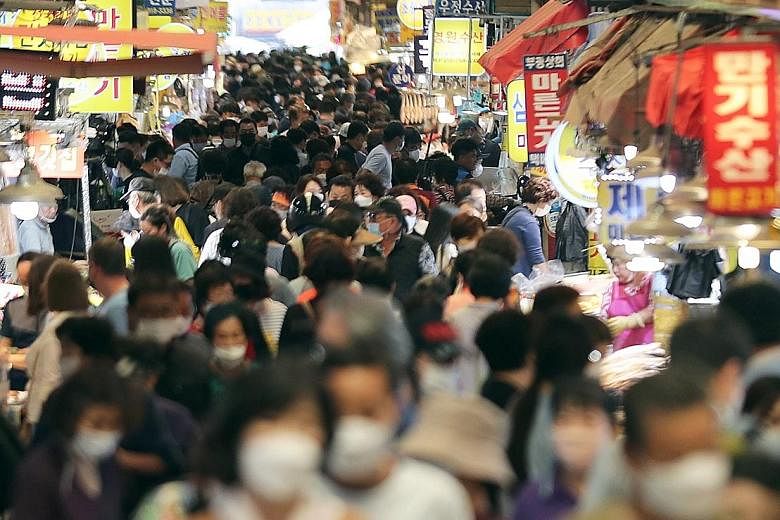 A crowded marketplace in Busan, South Korea, yesterday, ahead of the Chuseok holiday which takes place from Sept 30 to Oct 2. Social distancing policies for the holiday will be announced in the coming days as the authorities remain concerned about Co