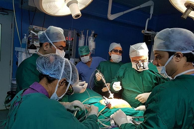 Dr Sanjeev Jadhav (second from right) of Mumbai's Apollo Hospital performing an organ transplant in Pune prior to the Covid-19 pandemic. The number of organ donations has fallen globally amid the pandemic, with India seeing 0.65 organ donation per mi