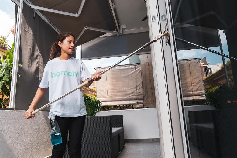 An employee of A1 Facility Services cleaning a house. The company employs between 100 and 200 staff, but is still facing a manpower shortage, with more people wanting more disinfection services. PHOTO: A1 FACILITY SERVICES