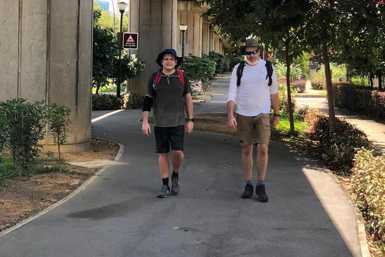 From left: Mr Simon Hamer and Mr Oliver Wingrove during their 58km walk from Raffles Marina in Tuas to Changi Beach last Saturday, in preparation for their longer trek with two others on Sept 30.