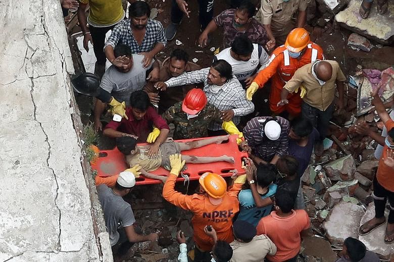 Thirteen people were killed and up to 25 are feared trapped after a three-storey residential building collapsed before dawn yesterday in the city of Bhiwandi in western India, officials said. Emergency workers from the National Disaster Response Forc