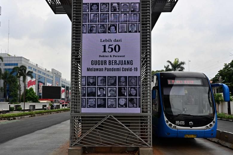 Portraits of doctors and nurses who have died from Covid-19 displayed as part of a public awareness campaign about the virus in Jakarta. Earlier this month, Indonesia's Covid-19 spokesman said the city's 67 Covid-19 referral hospitals had an occupanc