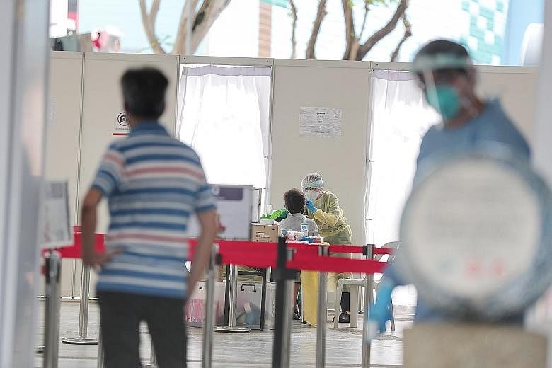 Stallholders and food delivery staff were tested for Covid-19 in Marine Parade, like at this site in Marine Drive, over the weekend as part of a pilot for stallholders in the constituency. ST PHOTO: KELVIN CHNG