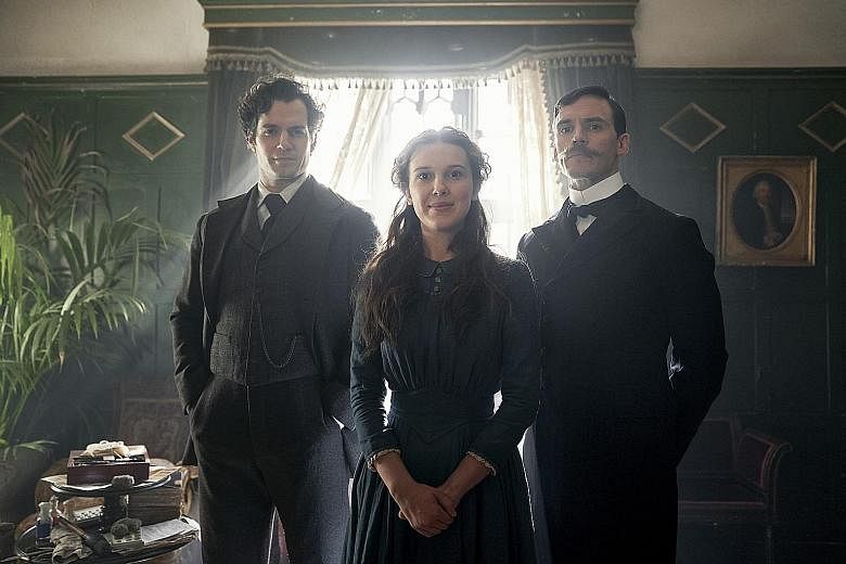 English actress Millie Bobby Brown is Enola Holmes in a new Netflix movie adapted from the young-adult book series written by Nancy Springer. Sam Claflin (left) and Henry Cavill (far left) play her older brothers Mycroft and Sherlock.